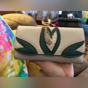 Guess wallet. Has some wear see pictures